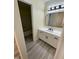 Bright bathroom with a modern vanity, sleek mirror, and stylish fixtures creates a refreshing and functional space at 5 Sue Ann Ct, Durham, NC 27704