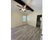 Spacious bedroom boasts high ceilings, fan, and convenient access to a bathroom, offering a comfortable retreat at 5 Sue Ann Ct, Durham, NC 27704