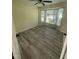 Bright bedroom with stylish floors and a large bay window offering plenty of natural light at 5 Sue Ann Ct, Durham, NC 27704