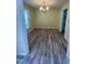 Cozy dining room with elegant chandelier, stylish floors, and natural light at 5 Sue Ann Ct, Durham, NC 27704