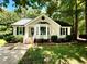 Charming single-story home features a bay window, black shutters, and lush landscaping at 5 Sue Ann Ct, Durham, NC 27704