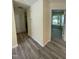 Inviting hallway features durable flooring, fresh paint, and seamless access to various living spaces at 5 Sue Ann Ct, Durham, NC 27704