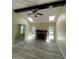 Bright living room features high ceilings, a fireplace, stylish floors, and ample natural light at 5 Sue Ann Ct, Durham, NC 27704