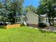 Lovely home with a fenced yard, complemented by a well-maintained lawn and mature trees at 5 Sue Ann Ct, Durham, NC 27704