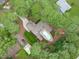 Aerial view featuring home's roof, backyard pool, and long driveway at 502 Hillcrest Rd, Apex, NC 27502