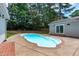 This backyard has a kidney-shaped pool and outdoor seating at 502 Hillcrest Rd, Apex, NC 27502