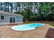 This backyard features an in-ground pool and a grassy area at 502 Hillcrest Rd, Apex, NC 27502