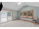 Well-lit bedroom with new carpet, vaulted ceiling, a sliding glass door, and views of the swimming pool at 502 Hillcrest Rd, Apex, NC 27502