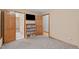 This bedroom has a closet, tv, and shelving for storage at 502 Hillcrest Rd, Apex, NC 27502