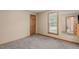 This bedroom boasts neutral walls, carpet, and a window letting in natural light at 502 Hillcrest Rd, Apex, NC 27502