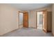 This bedroom offers doors to other rooms and neutral walls at 502 Hillcrest Rd, Apex, NC 27502