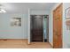 The home features a welcoming entryway with beautiful hardwood flooring and light blue walls at 502 Hillcrest Rd, Apex, NC 27502