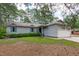 Charming single-story home with a well-maintained lawn, light grey siding, and a two-car garage at 502 Hillcrest Rd, Apex, NC 27502