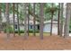 Charming single-story home with a well-maintained lawn, light grey siding, and a two-car garage surrounded by mature trees at 502 Hillcrest Rd, Apex, NC 27502