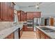 Well-equipped kitchen featuring granite countertops, stainless steel appliances, and custom cabinetry at 502 Hillcrest Rd, Apex, NC 27502