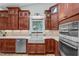 Charming kitchen with custom cabinets, a farmhouse sink, and a view of the backyard at 502 Hillcrest Rd, Apex, NC 27502