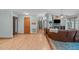 Inviting living room featuring hardwood floors, cozy seating, and a seamless transition to the kitchen at 502 Hillcrest Rd, Apex, NC 27502