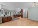 Open-concept living area with hardwood floors, bar seating, and seamless flow to the kitchen at 502 Hillcrest Rd, Apex, NC 27502