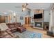 Spacious living area featuring a cozy fireplace, hardwood floors, and natural light at 502 Hillcrest Rd, Apex, NC 27502