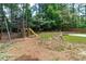 Backyard play set with slide and swings offers endless fun for children at 502 Hillcrest Rd, Apex, NC 27502