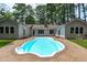 Inviting backyard pool for entertaining, surrounded by mature trees and attached to home at 502 Hillcrest Rd, Apex, NC 27502