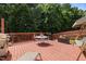 Relaxing back deck with seating, a grill, and a serene outdoor setting at 504 Ashburn Ln, Durham, NC 27703