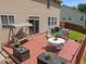 Inviting back deck with outdoor seating, a grill, and a leafy backyard view at 504 Ashburn Ln, Durham, NC 27703
