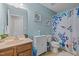 Cozy bathroom with a vanity, toilet, and a shower featuring a whimsical curtain at 504 Ashburn Ln, Durham, NC 27703