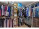 Walk-in closet with storage shelves and rods for organization at 504 Ashburn Ln, Durham, NC 27703
