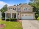 Charming two-story home with manicured lawn and a two-car garage, perfect for families at 504 Ashburn Ln, Durham, NC 27703