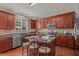 Attractive kitchen with stainless appliances, center island and wooden cabinetry at 504 Ashburn Ln, Durham, NC 27703