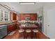 Spacious kitchen with stainless steel appliances, wood cabinets and breakfast bar at 504 Ashburn Ln, Durham, NC 27703