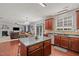Open kitchen with center island seamlessly connects to the living and dining spaces at 504 Ashburn Ln, Durham, NC 27703
