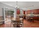 Well-equipped kitchen with a dining area, wood cabinets, and access to the deck at 504 Ashburn Ln, Durham, NC 27703