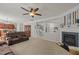 Open-concept living room with a fireplace and lots of space for entertaining at 504 Ashburn Ln, Durham, NC 27703