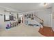 Open-concept living room featuring neutral carpet, staircase and an open layout at 504 Ashburn Ln, Durham, NC 27703
