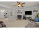 Cozy living room with a modern fireplace and an entertainment center at 504 Ashburn Ln, Durham, NC 27703