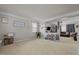 Bright and airy living room with neutral carpet, decor and ample natural light at 504 Ashburn Ln, Durham, NC 27703