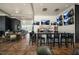 Modern bar area with a sleek counter, comfortable seating, and multiple TV screens for entertainment at 508 Morning Oaks Dr, Holly Springs, NC 27540