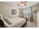 A cozy bedroom features a ceiling fan, a small window seat, and a comfortable bed at 508 Morning Oaks Dr, Holly Springs, NC 27540