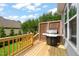 Outdoor deck featuring a grill, wood railings, and space for backyard barbecues at 508 Morning Oaks Dr, Holly Springs, NC 27540