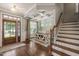 Elegant foyer featuring hardwood floors, a decorative ceiling, and staircase at 508 Morning Oaks Dr, Holly Springs, NC 27540