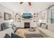 Cozy living room featuring a fireplace, built-in shelves, and comfortable seating at 508 Morning Oaks Dr, Holly Springs, NC 27540