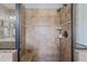 A tiled walk-in shower features updated shower fixtures and neutral tile at 508 Morning Oaks Dr, Holly Springs, NC 27540