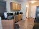 Kitchen showcasing stainless steel appliances and oak colored cabinetry for storage at 5126 Thornton Knoll Way, Raleigh, NC 27616