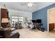 This bedroom has carpeted floors, a ceiling fan, and plenty of natural light at 513 Dragby Ln, Raleigh, NC 27603