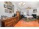 Cozy dining room with wood floors, large dresser, and a fireplace at 513 Dragby Ln, Raleigh, NC 27603