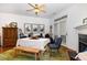 Bright dining area featuring a fireplace, wood floors, and access to the back patio at 513 Dragby Ln, Raleigh, NC 27603