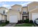Bright and inviting townhouse exterior with attached garages and well-kept lawn at 513 Dragby Ln, Raleigh, NC 27603