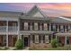 Attractive brick townhouse with black shutters and a well-maintained lawn at 513 Dragby Ln, Raleigh, NC 27603